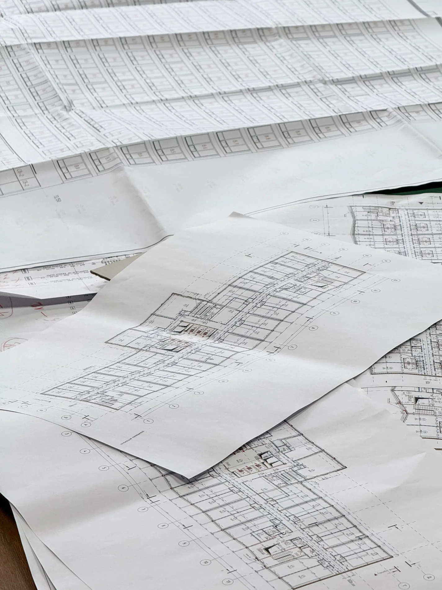 Detailed architectural blueprints on a desk